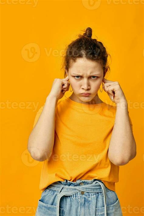 Pretty Girl In A Yellow T Shirt Posing Emotions Isolated Backgrounds Unaltered 25708773 Stock