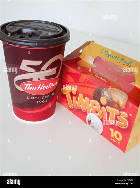 A Tim Hortons coffee cup and Timbits (doughnut holes, donut holes). Canada Stock Photo - Alamy