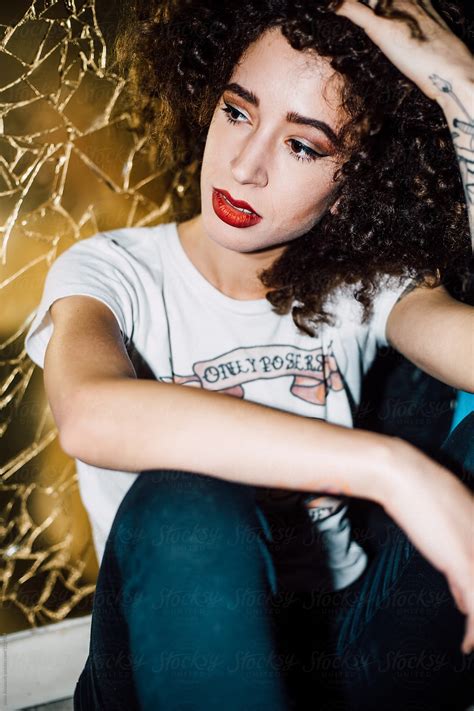 Portrait Of A Young Stylish Woman With A Curly Hair By Stocksy Contributor Boris Jovanovic