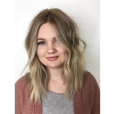 This Soft Wavy Textured Lob With Seamless Layers And Subtle Ash Blonde