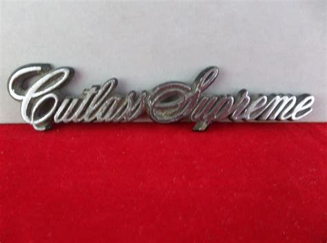 Oldsmobile Cutlass Supreme Chrome Plastic Sail Panel Emblem