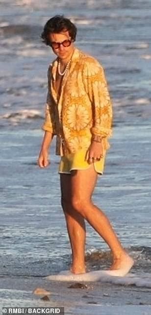 Harry Styles Is Chased Down The Beach By Dozens Of Models Daily Mail