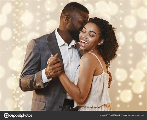 Beautiful happy black couple dancing in modern restaurant — Stock Photo ...