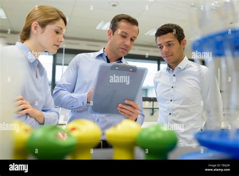 teacher with science students Stock Photo - Alamy