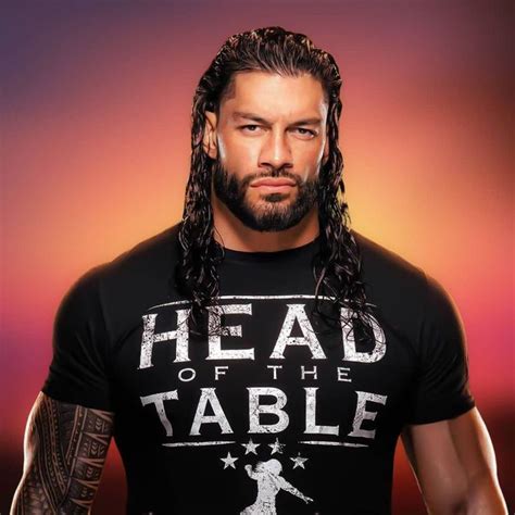 A Man With Long Hair Wearing A T Shirt That Says Head Of The Table