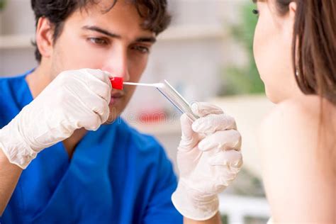 The Doctor Getting Saliva Test Sample In Clinic Hospital Stock Image