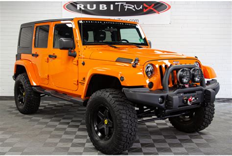 Pre-Owned 2012 Jeep Wrangler Sahara Unlimited Orange