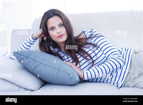 Beautiful Brunette Lying On The Couch Stock Photo Alamy