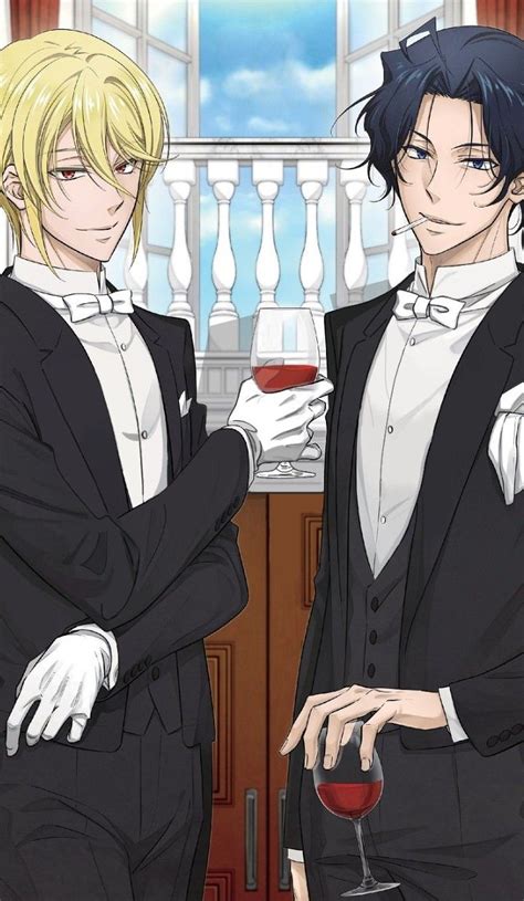 Two Men In Tuxedos Standing Next To Each Other Holding Glasses Of Red Wine