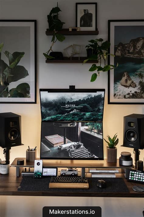 A Symmetrical Moody Desk Setup With Two Monitors Stacked Vertically