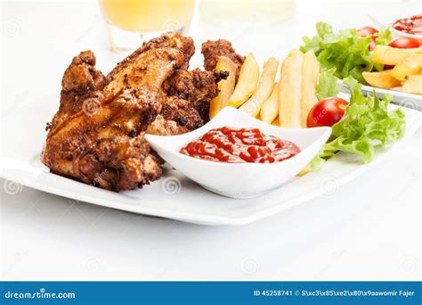 Chicken Wings With Fries French And Spicy Sauce Stock Image Image Of