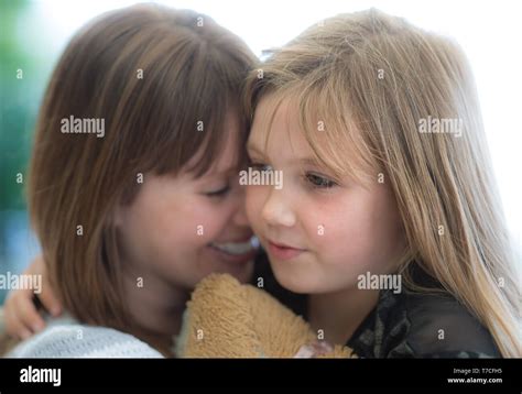 Mother And Young Daughter Cuddling Stock Photo Alamy