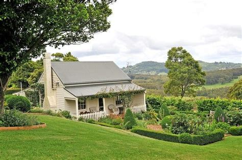 Australian Farmhouse surrounded by lush green grass