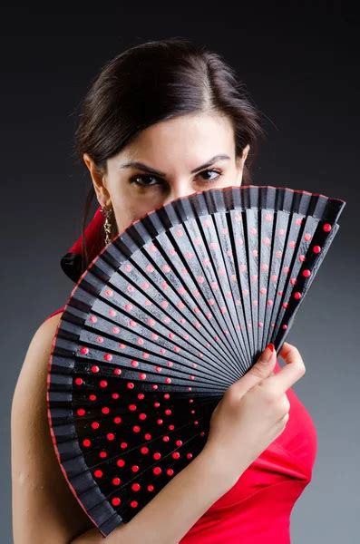 Woman with fan dancing dances - Stock Image - Everypixel