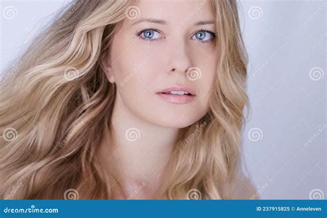 Beauty Hair Care And Natural Makeup Look Beautiful Woman With Long Blonde Wavy Curls Hairstyle