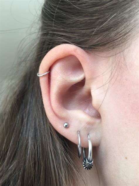 Triple Lobe And Helix Piercing