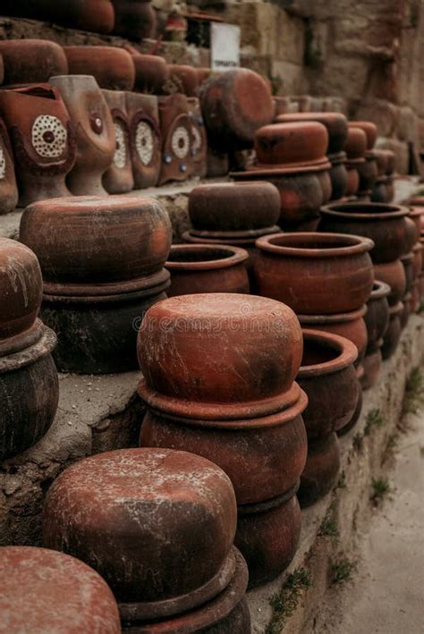 Stacks Of Handmade Ceramic Red Clay Brick Pots For Plants In A