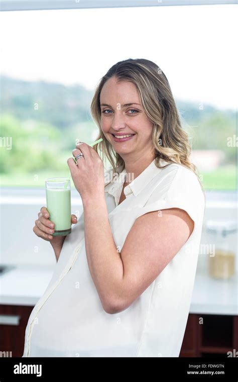 Pregnant Woman Drinking A Smoothie Stock Photo Alamy