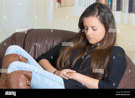 Pretty Brunette Looking Concentrated And Worried Stock Photo Alamy