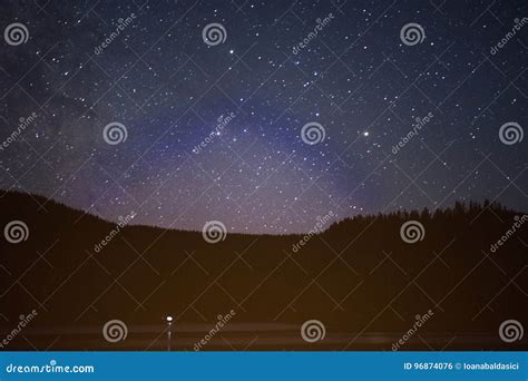 Starry Night Sky Over Mountain Lake And Forests Stock Photo Image Of