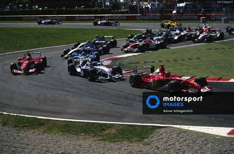 Michael Schumacher Ferrari F2003 GA Leads Juan Pablo Montoya