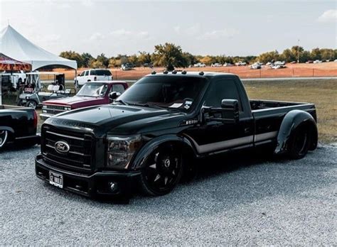 Black Dually Trucks in a Parking Lot