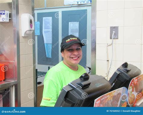 Restaurant Employee With Ppe Serve A Customer At The Drive Thru