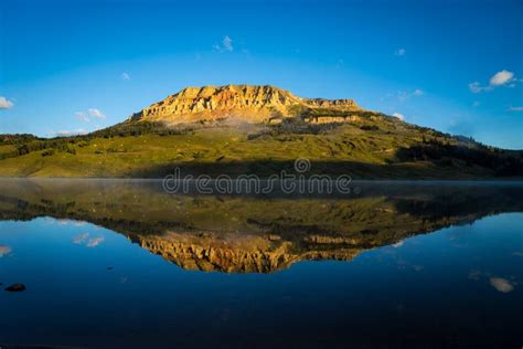 Sunrise on Lake with Bear To Butte in the Background, Montana Stock ...