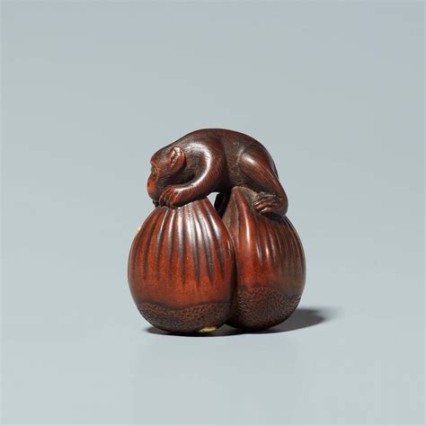 A Boxwood And Ivory Netsuke Of A Monkey With A Worm Mid 19th Century