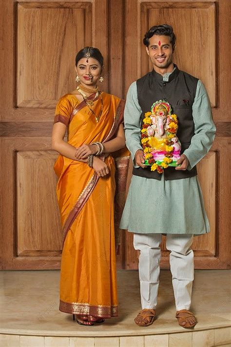 Portrait Of Happy Maharashtrian Couple In Traditional Dress Celebrating