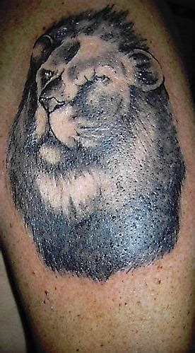 Lion head black in tattoo - Tattooimages.biz