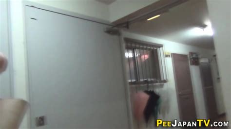 Clothed Japanese Babe Urinates