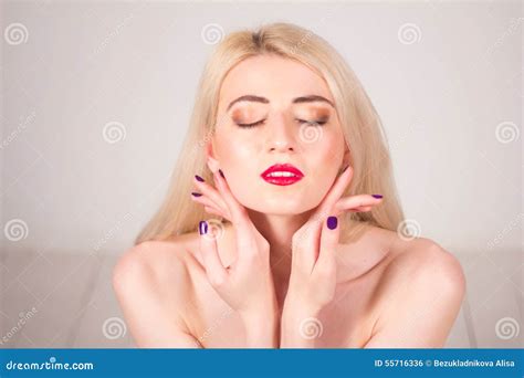 Beauty Concept Beautiful Woman With Blond Straight Hair And Red Lips Touching Her Skin