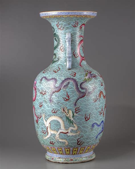 A CHINESE BLUE GROUND FAMILLE ROSE DRAGONS VASE