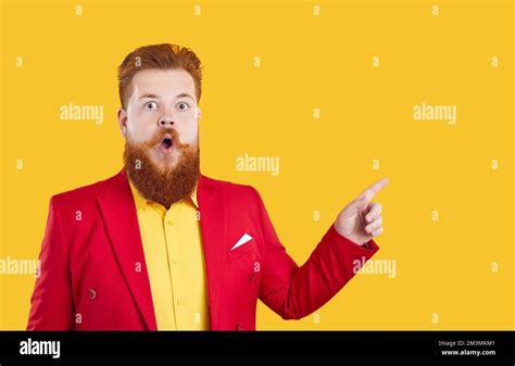 Funny Fat Man With Shocked Expression Points To Place For Advertising