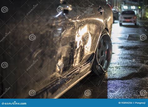 Red Damaged Car In Crash Accident With Scratched Paint And Dented Metal