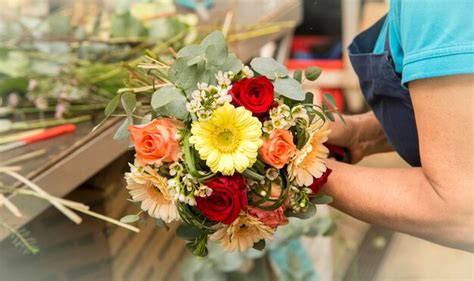 Premium Photo Midsection Of Florist Holding Bouquet In Flower Shop