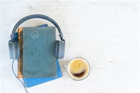 Audio Book Concept Headphones With Books And Cup Of Fresh Coffee On