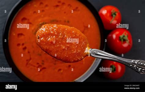 Spoon Of Hot Tomato Soup Over Bowl Closeup Eating Vegetable Dish Of