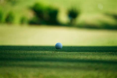 Premium Photo Golf Ball On Grass