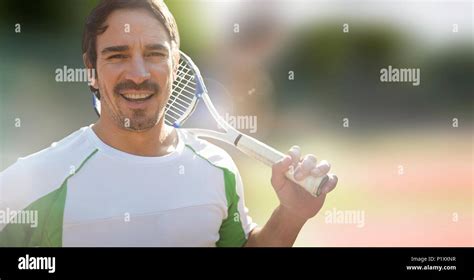 Tennis Player Man With Bright Background With Racket Stock Photo Alamy