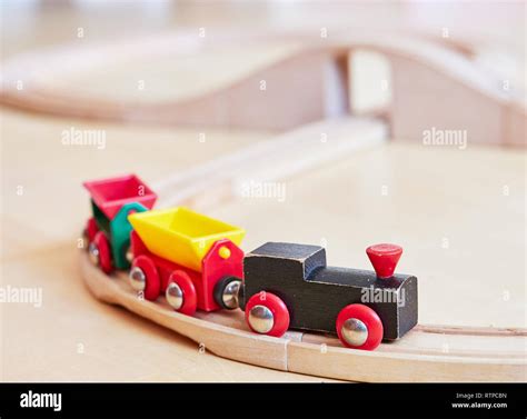 Wooden Toy Train Running On Miniature Railway Tracks The Black Engine