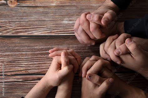 Praying Hands On A Wooden Background With Copy Space Top Table View