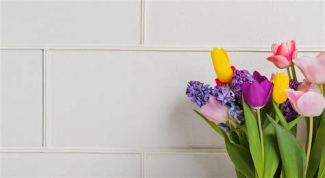 Premium Photo Bouquet Of Colorful Tulip Flowers White Wall Copy Space