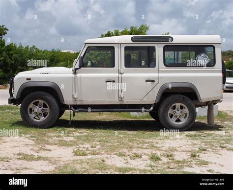 Side View Of A White Land Rover Defender 110 Anguilla Bwi Stock Photo