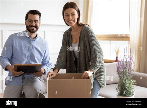 Portrait Of Happy Couple Unpack Boxes Moving Together Stock Photo Alamy