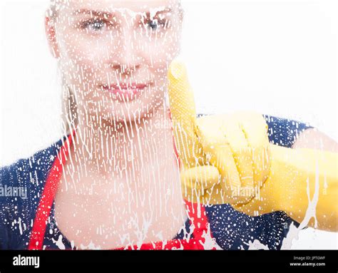 Female Housekeeper Touching The Glass With Foam In Close Up View