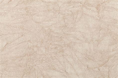 Premium Photo Light Beige Wavy Background From A Textile Material