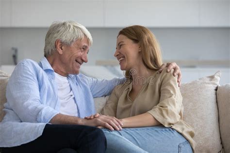 Cheerful Caring Mature Father Talking To Pretty Daughter Stock Image
