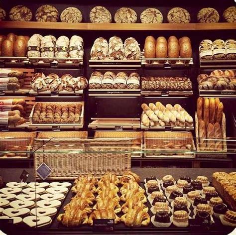 A Bakery Filled With Lots Of Different Types Of Breads And Pastries On